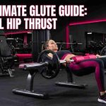 Woman performing barbell hip thrust exercise for glute strength and muscle growth in gym